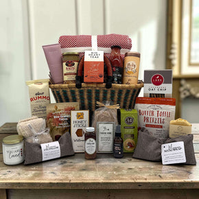 handwoven basket with a variety of food items and snacks