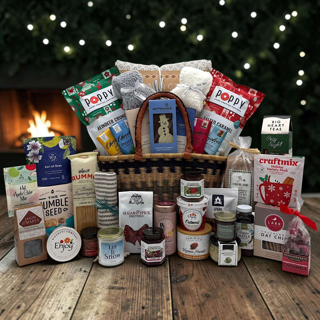 African Market deluxe basket filled with holiday themed snacks and other items, socks, chocolate, cookies, pretzels, and more
