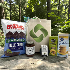 healthy inspired gift with blue corn chips, salsa, bruschetta, crackers and lemon cookies