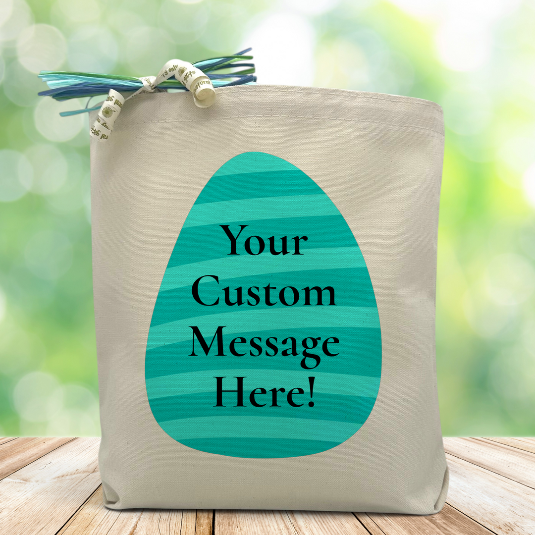 A Blue striped Easter egg with a chance to place a custom message inside, set on a wood table with green blurred background 