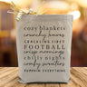 A all black text saying cozy blankets, crunchy leaves, crackling fires, crisp mornings, chilly nights, comfy sweaters and pumpkin everything, on a canvas tote bag.