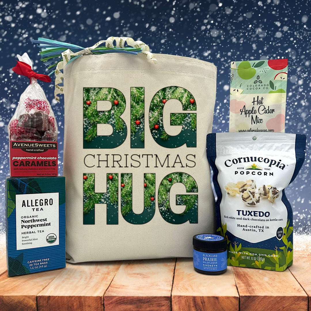 Gourmet christmas gift basket with peppermint caramels, tea, honey, chocolate popcorn and apple cider