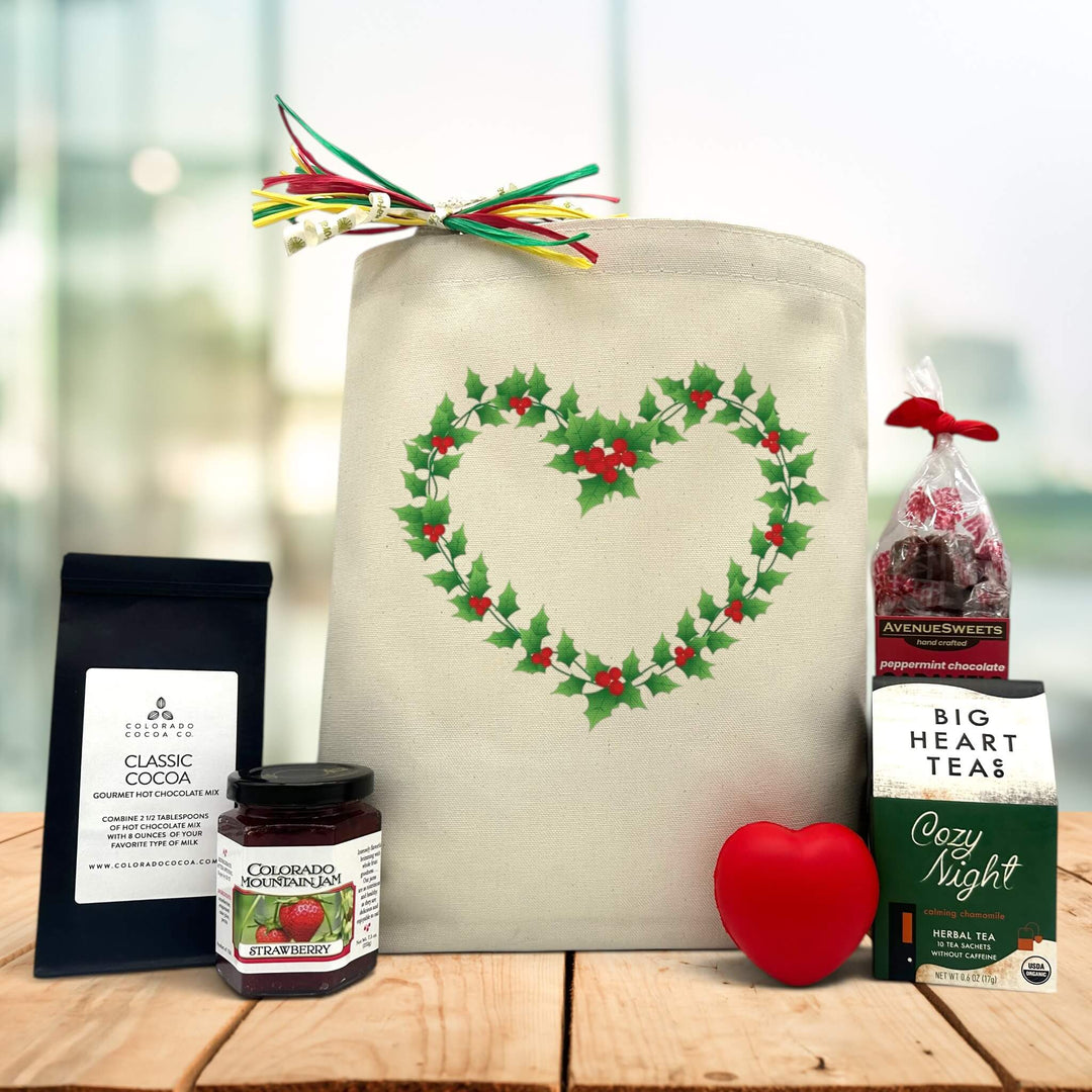 Gourmet holiday gift basket with cocoa, jam, heart squeeze, cozy night tea, and peppermint caramels