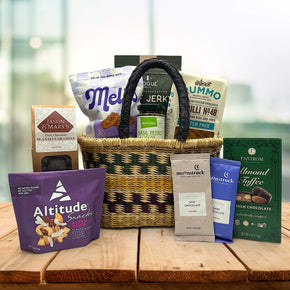 handwoven basket with cookies, jerkys, pasta, pesto, caramels, trailmix, almond toffee and cocoa