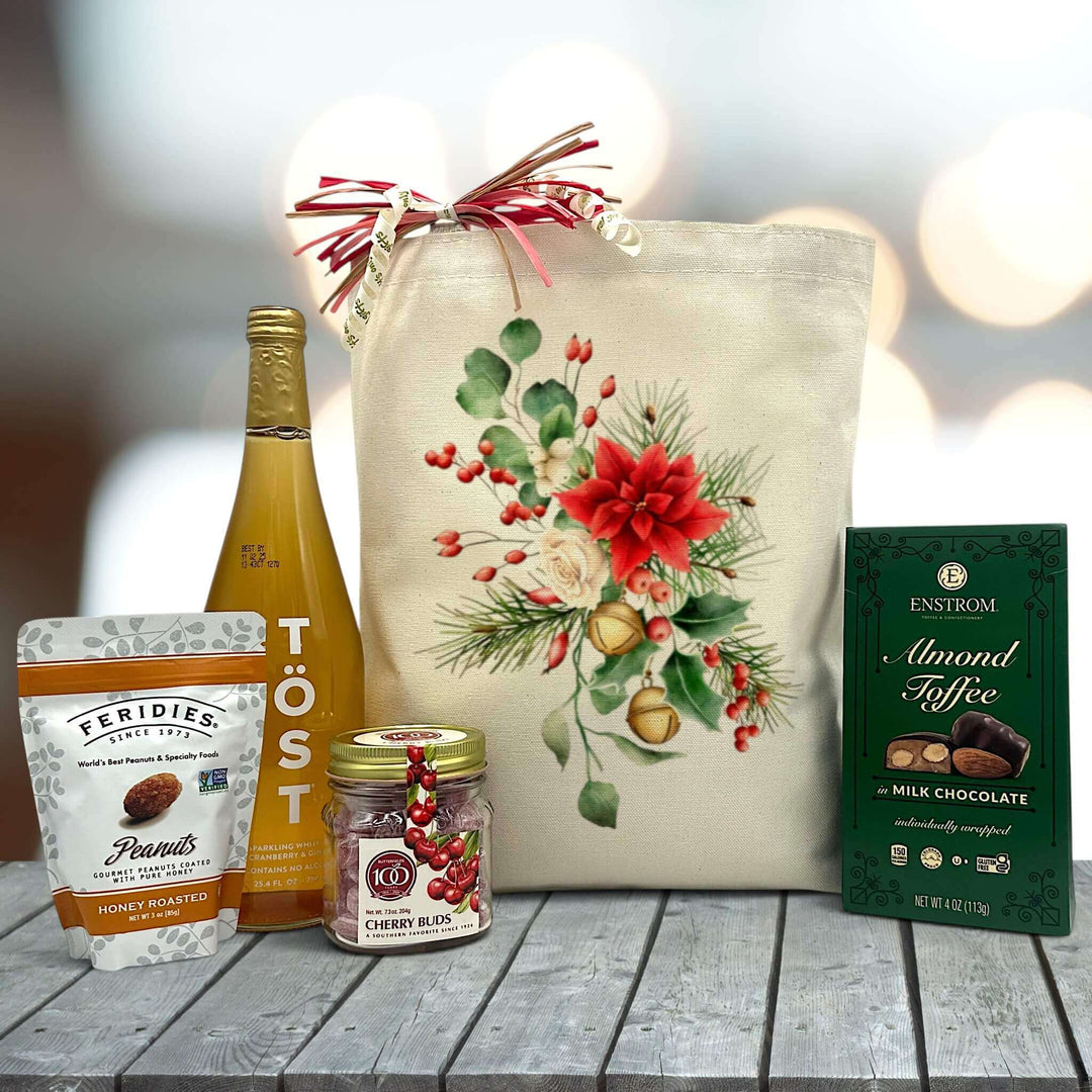 Holiday gift basket with peanuts, sparkling juice, cherry buds and almond toffee