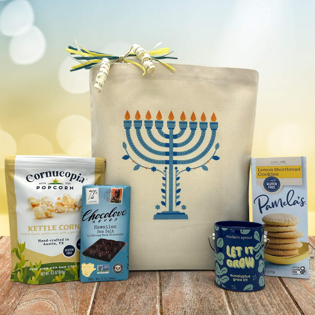 Gourmet Hanukkah gift basket with popcorn, a chocolate bar, a plant growing kit, and cookies