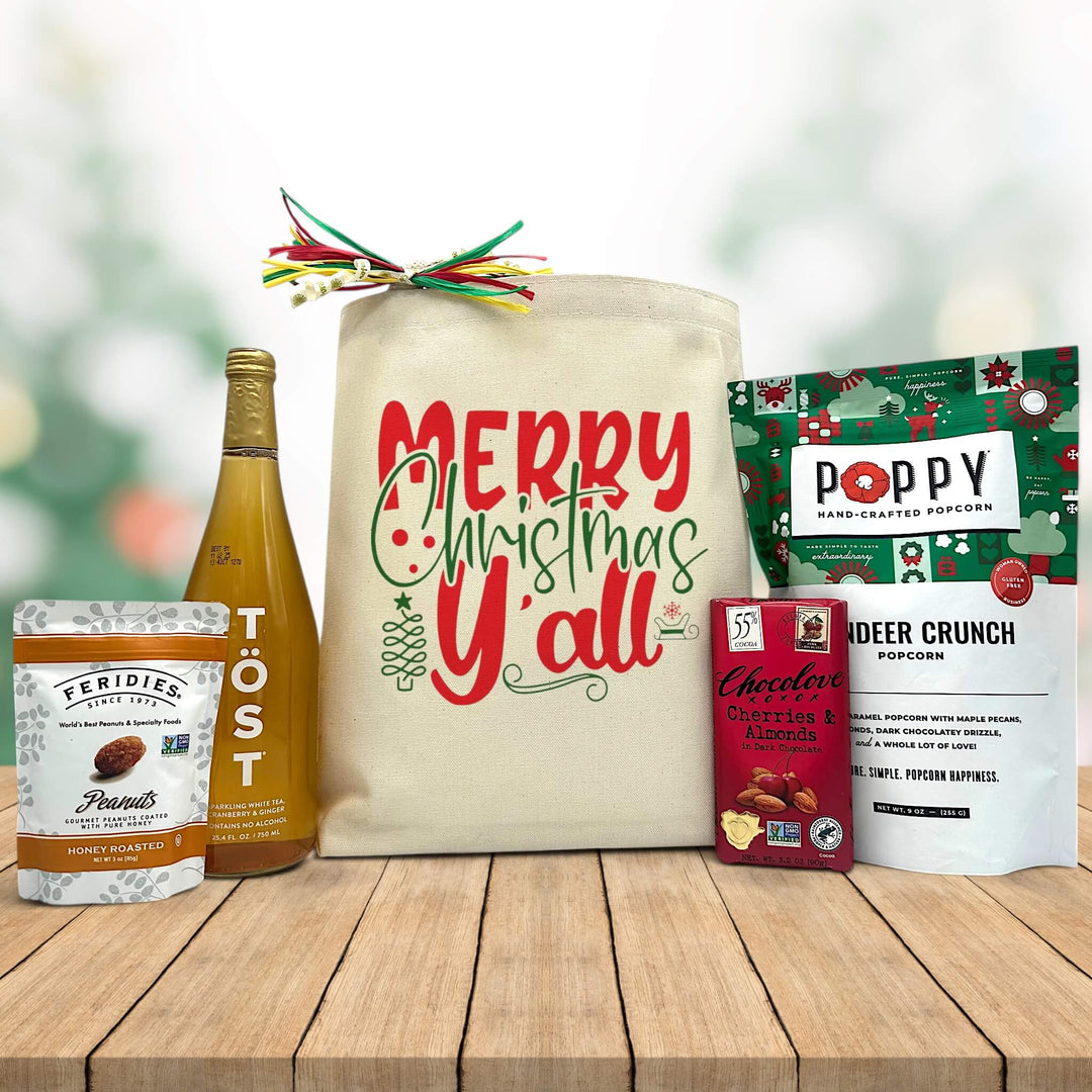 Gourmet christmas gift basket with peanuts, sparking juice, chocolate bar and reindeer crunch popcorn