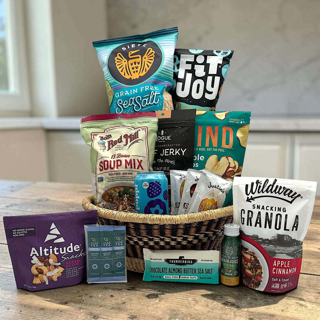 handwoven basket with chips, pretzels, soup, jerky, apple chips, drinks, trail mix, granola and more