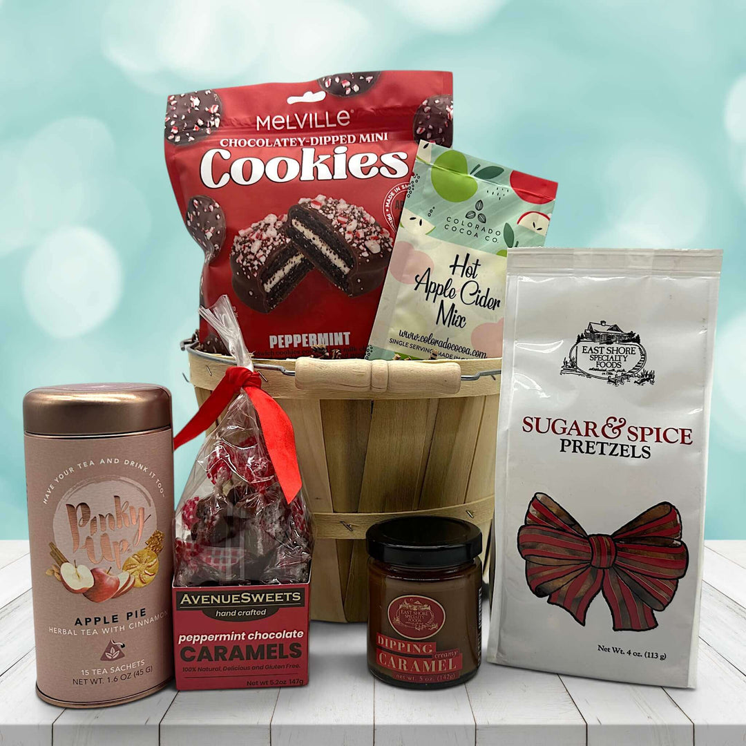 apple bushel basket with cookies, pretzels, tea, caramels and applie cider mix