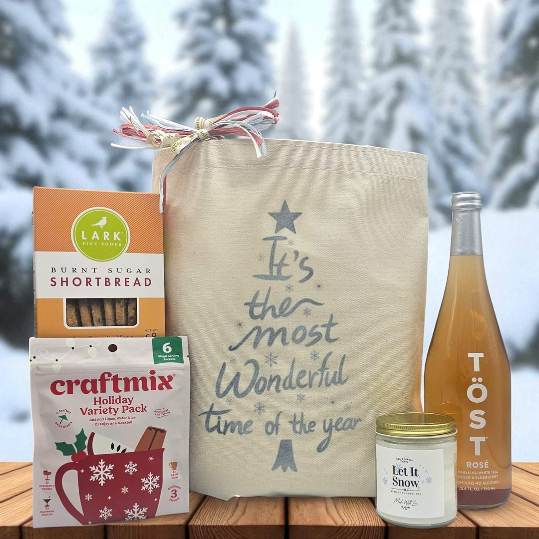 Gourmet holiday gift basket with cookies, holiday craft mix, large candle and sparkling juice