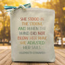 a rainbow quote saying she stood in the storm and when the wind did not blow her away, she adjusted her sails by Elizabeth Edwards printed on a canvas tote bag.