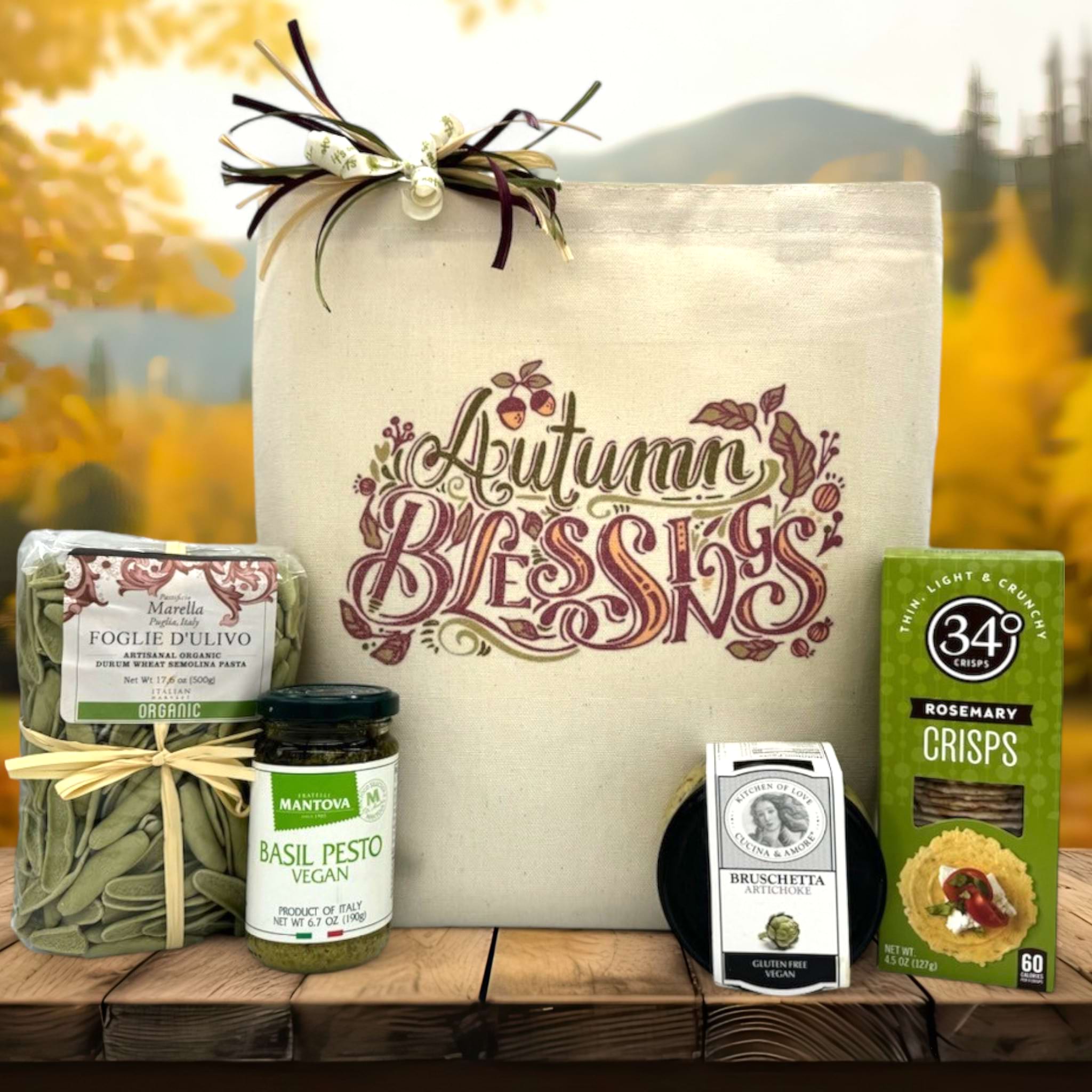 gorumet fall gift basket with pasta, pesto, bruschett and rosemary crackers sitting on a table