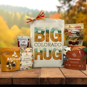 big colorado hug with an autumn scene canvas tote bag with trail mix, oatmeal, pumpkin chai, tea, and caramels
