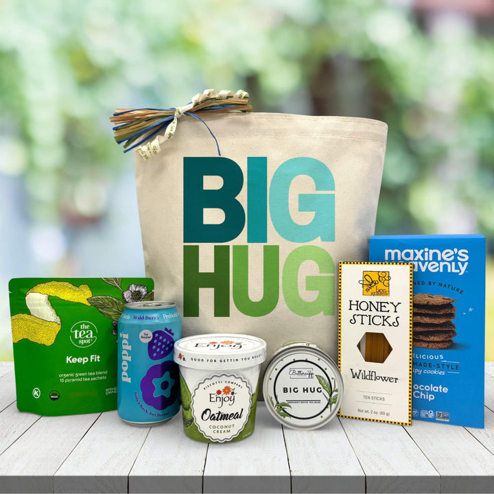Big Hug gift set with canvas tote, Poppi soda, green tea, oatmeal, honey sticks, and chocolate chip cookies