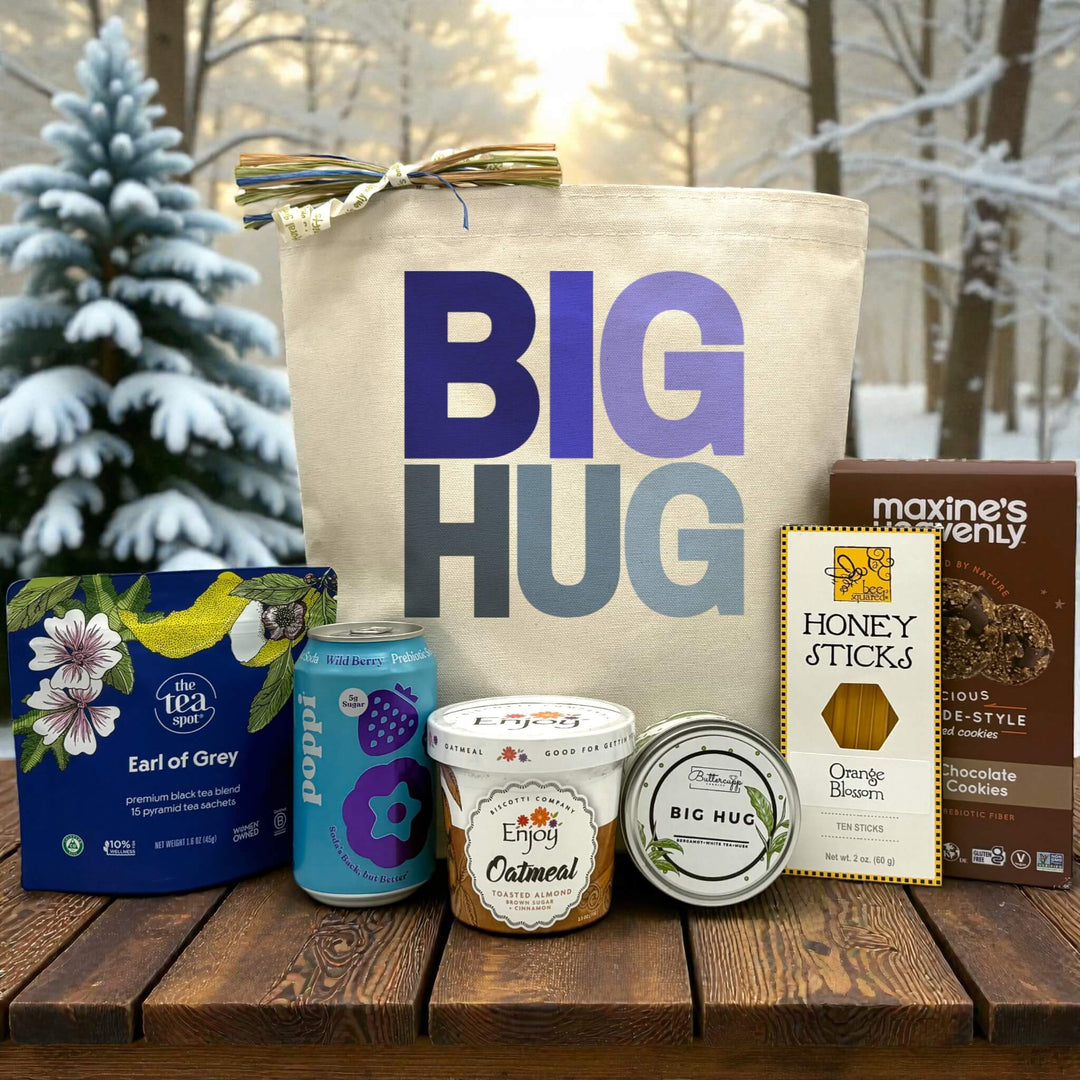 Blue Big Hug printed on canvas tote bag with tea, poppi, oatmeal, candle, honey, and cookies