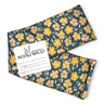 blue, yellow, green printed fabric making a neck wrap