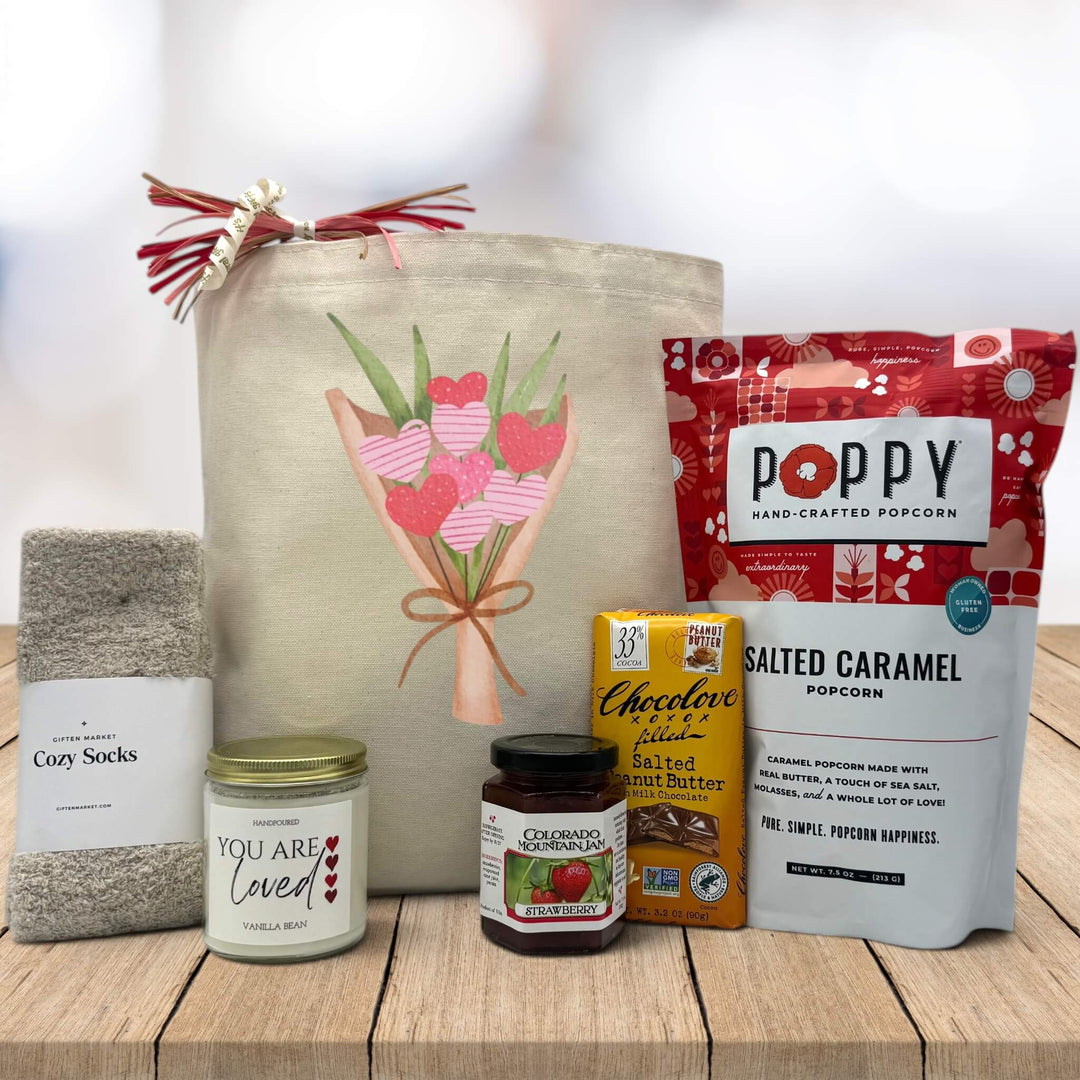 flower bouquet of hearts printed on canvas tote bag with socks, candle, jam, chocolate bag and popcorn