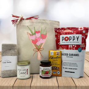 flower bouquet of hearts printed on canvas tote bag with socks, candle, jam, chocolate bag and popcorn