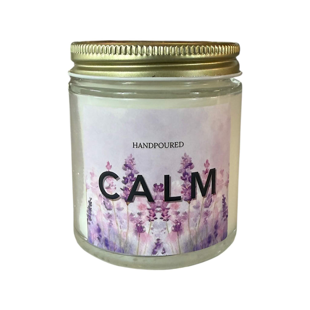purple background with lavender  and the word calm printed on a candle
