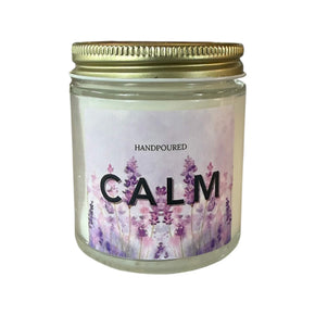 purple background with lavender  and the word calm printed on a candle