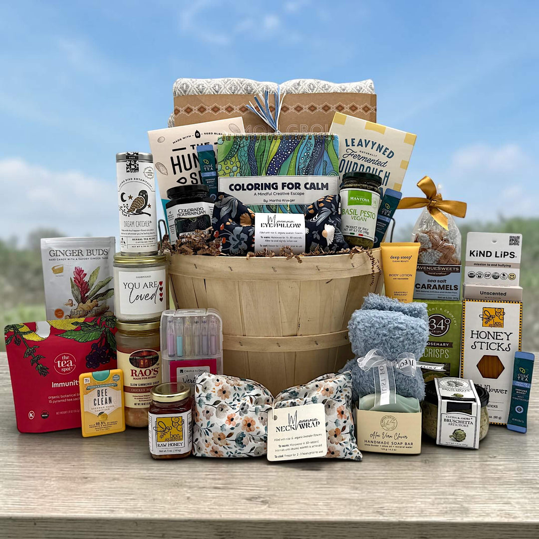 half bushel filled with spa items like blanket, lotion, eye pillow, soups, crackers teas and more