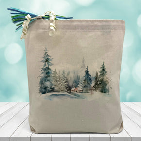 cozy cabin scene printed on a canvas tote bag sitting on a table with a blurred blue background