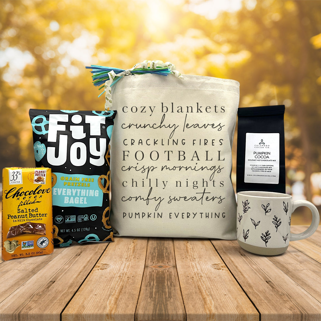 gourmet gift basket with chocolate, pretzels, cocoa, and a mug