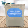 custom blue text message printed on canvas tote bag sitting on table with white blurred background