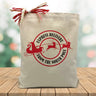 express delivery from the north pole  printed on a canvas tote sitting on a wood table