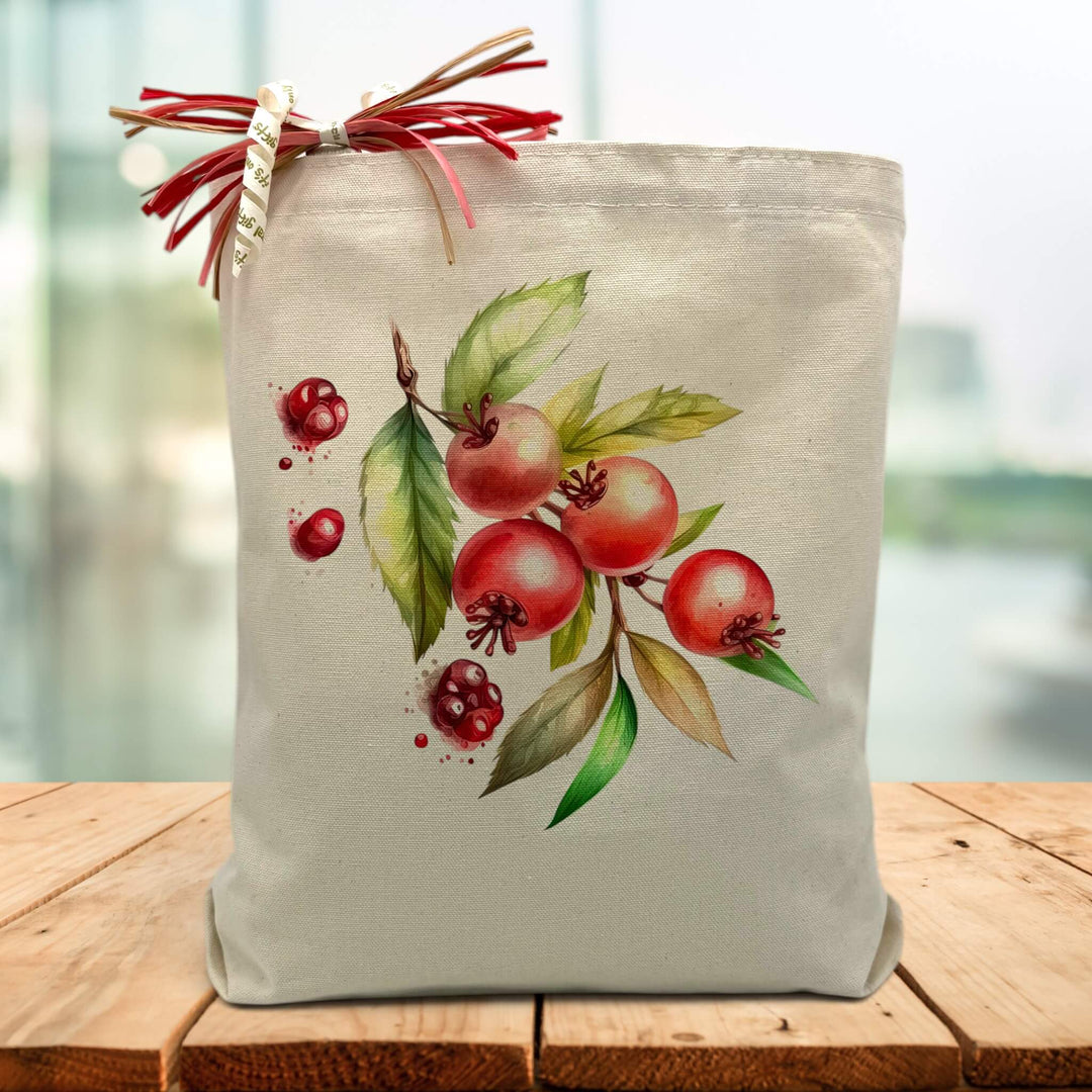 holiday berrys printed on a canvas tote bag sitting on a wood table