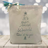 Its the most wonderful time of the year in silver printed on a canvas tote bag sitting on a wood table