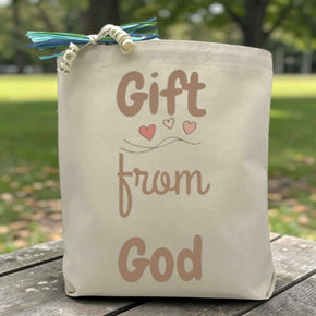 Gift from God printed on a tote bag sitting on a table