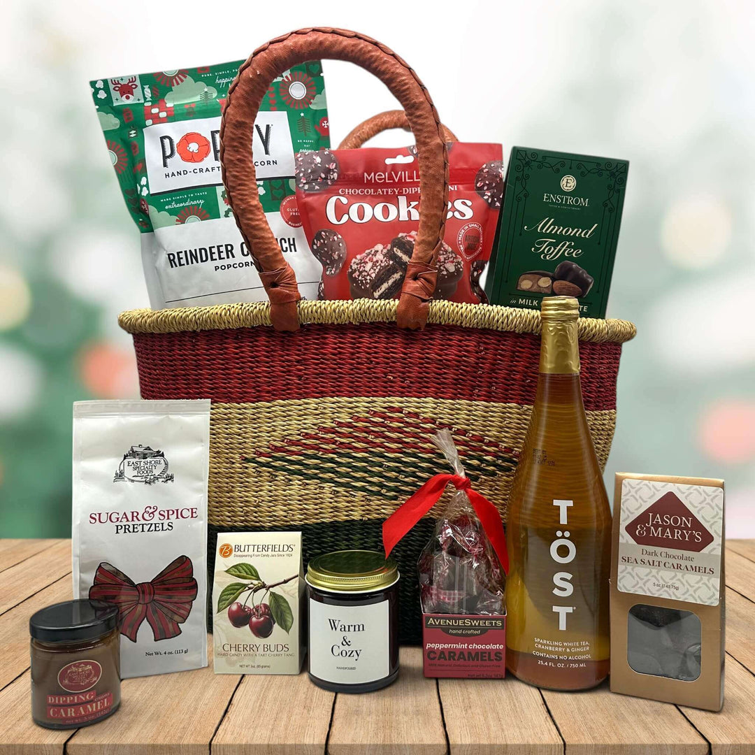 large handwoven holiday basket with popcorn, cookies, almond toffee, pretzels wit caramel, cherry buds, candle, peppermint caramels, sparking juice and more caramels