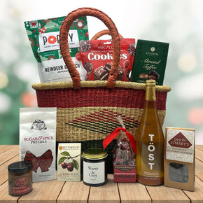 large handwoven holiday basket with popcorn, cookies, almond toffee, pretzels wit caramel, cherry buds, candle, peppermint caramels, sparking juice and more caramels