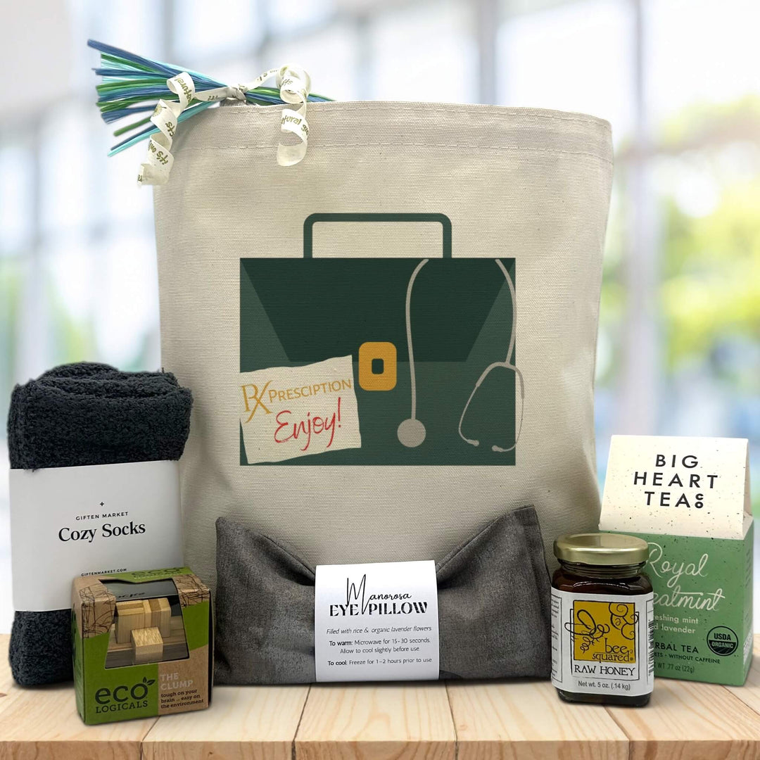 canvas tote bag with a doctor briefcase printed on it with socks, puzzle, eye pillow, honey jar, and tea