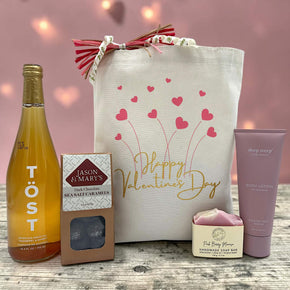 valentines gift with sparkling juice, caramels, soap and lotion