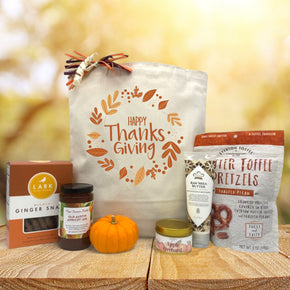 Gourmet thanksgiving basket with cookies, jam, knit pumpkin, a candle, lotion and toffee pretzels
