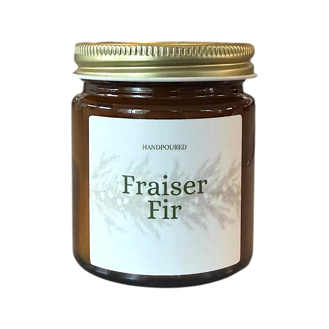 fraiser fir with fraiser printed on the front of an amber candle