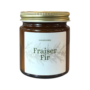 fraiser fir with fraiser printed on the front of an amber candle