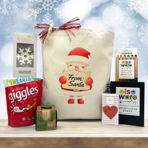 Gourmet holiday gift basket with a chocolate bar, candies, puzzle, tisues and watercolor pad and pencil