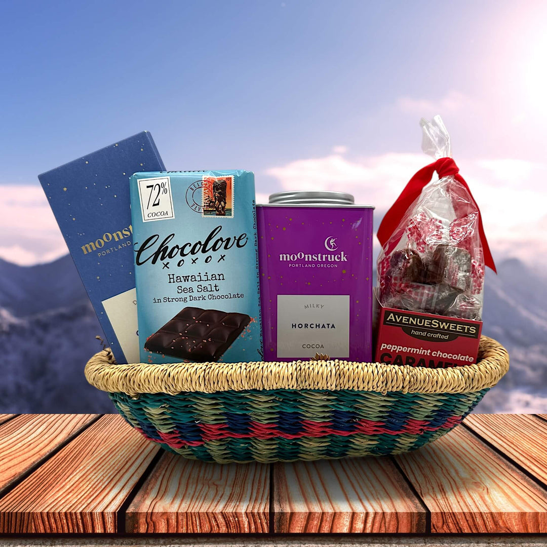 handwoven basket with chocolate bars cocoa and caramels