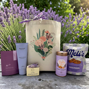 floral gift basket with bath satls, lotion, soap, tea, and cookies
