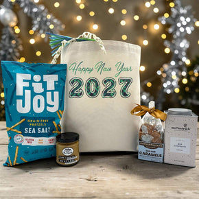 2027 gift basket with pretzels and mustard, caramels and cocoa