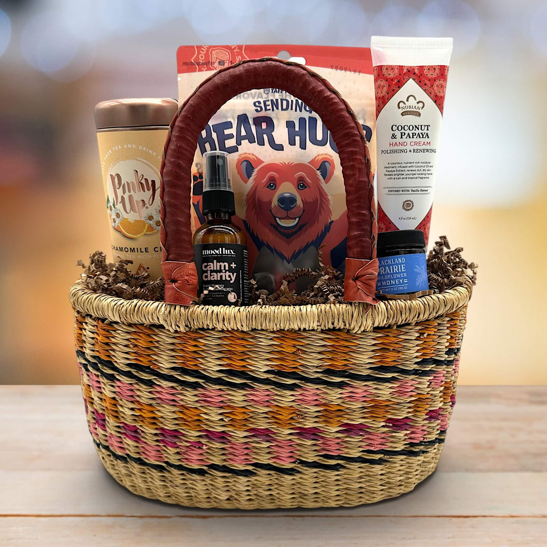 handwoven basket with tea, calming spritz, sending bear hugs taffy, honey and lotion