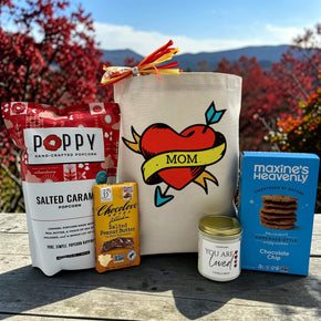 mom gift basket with popcorn, chocolate bar, large candle, and cookies