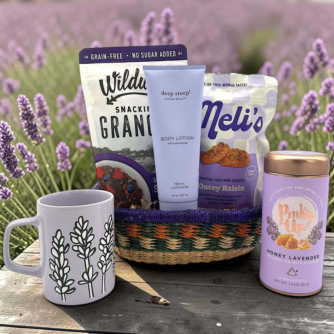 Handwoven basket with lavender themed products, granola, cookies, lotion, tea, and a mug
