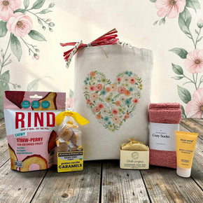 floral gift tote with fruit chips, caramels, soap, lotion and socks