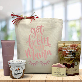got it from my mama written on tote bag sitting on table with lotion, oatmeal, soap, and caramels