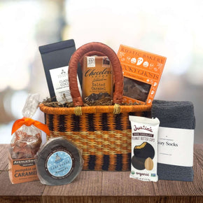 African market basket with cocoa, chocolate, cookies, caramels, justin peanut butter bar and socks