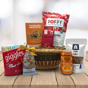 handwoven african tray with cookies, popcorn, chocolate, caramels, poppi and granola